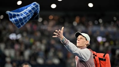 Italy's Jannik Sinner throws his towel towards fans after his men's singles quarter-final match against Russia's Andrey Rublev (AFP) Italy's Jannik Sinner throws his towel towards fans after his men's singles quarter-final match against Russia's Andrey Rublev (AFP)
