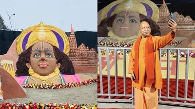 Uttar Pradesh CM Yogi Adityanath taking a selfie with the sand art created by Sudarsan Pattnaik. (X/@sudarsansand) Uttar Pradesh CM Yogi Adityanath taking a selfie with the sand art created by Sudarsan Pattnaik. (X/@sudarsansand)