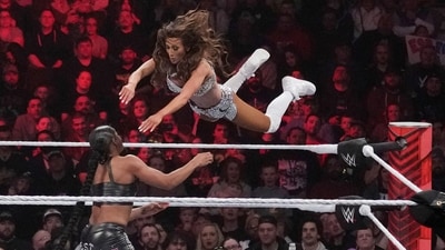 Wrestler Carmella leaps at Bianca Belair, during the WWE Monday Night RAW event (AP) Wrestler Carmella leaps at Bianca Belair, during the WWE Monday Night RAW event (AP)