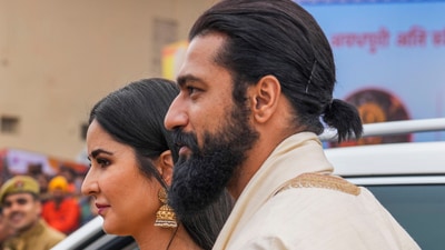 Vicky Kaushal and Katrina Kaif arrive for the consecration ceremony at the Ram Mandir. While Vicky was in a white kurta-pyjama and carried a shawl, Katrina was in a golden saree and gold jewellery. (PTI) Vicky Kaushal and Katrina Kaif arrive for the consecration ceremony at the Ram Mandir. While Vicky was in a white kurta-pyjama and carried a shawl, Katrina was in a golden saree and gold jewellery. (PTI)