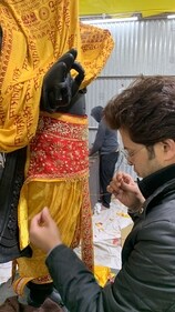 Manish Tripathi working on the idol's vastra