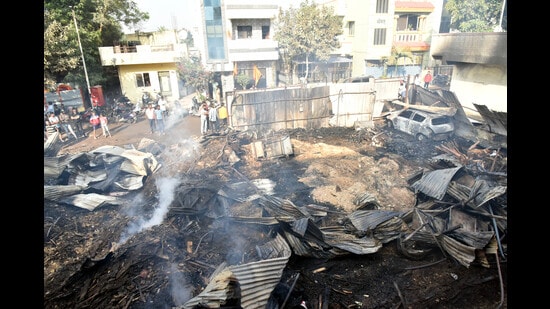 The fire broke out at Ganesh Packaging Industry (timber shop) before spreading to nearby profile door manufacturing workshop Vinayak Aluminium. (HT PHOTO)