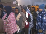 Devotees wait in queue for their turn to glimpse Lord Ram's idol.