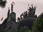 This file photo taken on December 6, 1992 shows Hindu kar sewaks shouting and waving banners as they stand on the top of a stone wall and celebrate the destruction of the 16th Century Babri Mosque in Ayodhya. This file photo taken on December 6, 1992 shows Hindu kar sewaks shouting and waving banners as they stand on the top of a stone wall and celebrate the destruction of the 16th Century Babri Mosque in Ayodhya.