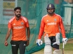 India's captain Rohit Sharma with teammate Mohammed Siraj during a practice session 