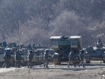 South Korean army soldiers pass by their armored vehicles during a military exercise in Paju, South Korea, near the border with North Korea, Wednesday, Jan. 24, 2024. (AP Photo/Ahn Young-joon)