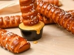 Cinnabon Footlong Churros, Auntie Anne’s Footlong Pretzels and Footlong Cookies have been made available in the U.S. as a part of their “big menu update.”
