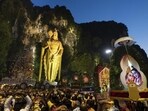 Giant Kavadi offering cages are carried by Hindu devotees in a procession during the Thaipusam festival at Batu Caves, outskirts of Kuala Lumpur.(AP)