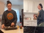 Woman singing Celine Dion’s My Heart Will Go On in her kitchen. Woman singing Celine Dion’s My Heart Will Go On in her kitchen.