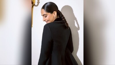 With the help of hairstylist Hyungsun Ju, Sonam has pinned her lush long locks to the middle and tied them into two braided ponytails, which suits her look perfectly. Her hairdo is sure to set trends. (Instagram/@sonamkapoor) With the help of hairstylist Hyungsun Ju, Sonam has pinned her lush long locks to the middle and tied them into two braided ponytails, which suits her look perfectly. Her hairdo is sure to set trends. (Instagram/@sonamkapoor)