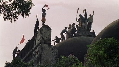 This file photo taken on December 6, 1992 shows Hindu kar sewaks shouting and waving banners as they stand on the top of a stone wall and celebrate the destruction of the 16th Century Babri Mosque in Ayodhya. (AFP) This file photo taken on December 6, 1992 shows Hindu kar sewaks shouting and waving banners as they stand on the top of a stone wall and celebrate the destruction of the 16th Century Babri Mosque in Ayodhya. (AFP)