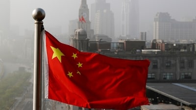 FILE - A Chinese national flag flutters against office buildings in Shanghai, China, on April 14, 2016. China faces international scrutiny Tuesday, Jan. 23, 2024, over domestic polices in places like Hong Kong, Tibet and the western Xinjiang region as the global power receives its latest U.N.-backed review of its human rights record. (AP Photo/Andy Wong, File) (AP) FILE - A Chinese national flag flutters against office buildings in Shanghai, China, on April 14, 2016. China faces international scrutiny Tuesday, Jan. 23, 2024, over domestic polices in places like Hong Kong, Tibet and the western Xinjiang region as the global power receives its latest U.N.-backed review of its human rights record. (AP Photo/Andy Wong, File) (AP)