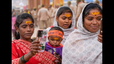 Devotees arrive at the Ram Mandir on a cold winter morning, in Ayodhya, Wednesday. (PTI) Devotees arrive at the Ram Mandir on a cold winter morning, in Ayodhya, Wednesday. (PTI)