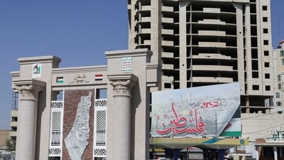 Houthis in Yemen: People walk at a roundabout which was renamed by the Houthis to "Palestine", in Sanaa, Yemen. (Reuters)