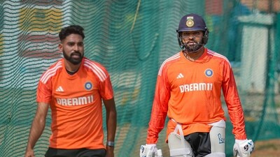 India's captain Rohit Sharma with teammate Mohammed Siraj during a practice session (PTI) India's captain Rohit Sharma with teammate Mohammed Siraj during a practice session (PTI)