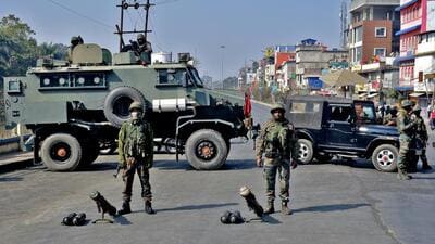 Soldiers block a road leading to the Kangla Fort, the venue of a meeting between the state lawmakers and members of Arambai Tenggol, a Meitei group, in Imphal, on Wednesday. (REUTERS) Soldiers block a road leading to the Kangla Fort, the venue of a meeting between the state lawmakers and members of Arambai Tenggol, a Meitei group, in Imphal, on Wednesday. (REUTERS)