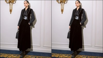 Sonam's outfit features a grey, full-sleeved shirt with a collar neckline and buttoned bodice. She teamed it with a black half-sleeved jacket adorned with intricate white embroidery and a black maxi skirt with a corset belt at the waist for extra flair. (Instagram/@sonamkapoor) Sonam's outfit features a grey, full-sleeved shirt with a collar neckline and buttoned bodice. She teamed it with a black half-sleeved jacket adorned with intricate white embroidery and a black maxi skirt with a corset belt at the waist for extra flair. (Instagram/@sonamkapoor)