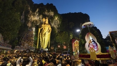Giant Kavadi offering cages are carried by Hindu devotees in a procession during the Thaipusam festival at Batu Caves, outskirts of Kuala Lumpur. (AP) Giant Kavadi offering cages are carried by Hindu devotees in a procession during the Thaipusam festival at Batu Caves, outskirts of Kuala Lumpur. (AP)