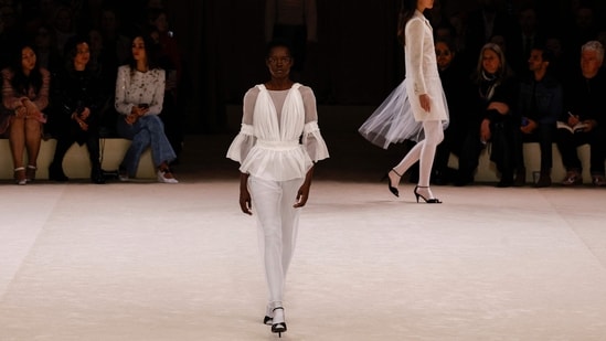 Models present a creation for Chanel during the Women's Haute-Couture Spring/Summer 2024 Fashion Week in Paris on January 23, 2024.(Photo by Geoffroy VAN DER HASSELT / AFP)) Models present a creation for Chanel during the Women's Haute-Couture Spring/Summer 2024 Fashion Week in Paris on January 23, 2024.(Photo by Geoffroy VAN DER HASSELT / AFP))