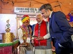 Prime Minister Narendra Modi explains the UPI digital payments system to French President Emmanuel Macron during their visit to Jaipur on Thursday. (ANI) Prime Minister Narendra Modi explains the UPI digital payments system to French President Emmanuel Macron during their visit to Jaipur on Thursday. (ANI)