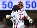 The West Indies' Joshua Da Silva, right, is congratulated by teammate Kavem Hodge