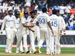 India's Ravindra Jadeja (C) celebrates with teammates after taking the wicket of England's Joe Root during the first day of the first Test cricket match between India and England at the Rajiv Gandhi International Stadium in Hyderabad on January 25, 2024. (Photo by Noah SEELAM / AFP) / -- IMAGE RESTRICTED TO EDITORIAL USE - STRICTLY NO COMMERCIAL USE --(AFP)