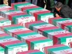 A man mourning over coffins draped with the Iranian flag during the funeral of victims killed in twin blasts on January 3. (AFP) A man mourning over coffins draped with the Iranian flag during the funeral of victims killed in twin blasts on January 3. (AFP)