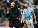 Manchester City manager Pep Guardiola celebrates with Mateo Kovacic after the match 