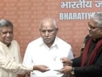 Jagadish Shettar (left) was welcomed back to the BJP -- around nine months after he left the party and joined Congress.