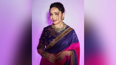 Assisted by hairstylist Madhuri Nakhale, the actress styled her lush locks into soft curls and tied them up in a messy bun, leaving the locks open at the front, which framed her face beautifully. The addition of a small black bindi on her forehead added the perfect finishing touch. (Instagram/@madhuridixitnene) Assisted by hairstylist Madhuri Nakhale, the actress styled her lush locks into soft curls and tied them up in a messy bun, leaving the locks open at the front, which framed her face beautifully. The addition of a small black bindi on her forehead added the perfect finishing touch. (Instagram/@madhuridixitnene)
