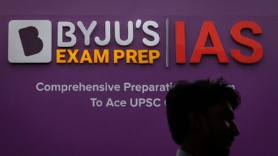 A man walks past an advertising hoarding of Byju's, an Education Technology company and one of India's biggest startup, outside one of its branches in New Delhi