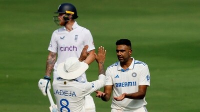 Ravichandran Ashwin celebrates with Ravindra Jadeja after taking the wicket of England's Mark Wood (REUTERS)