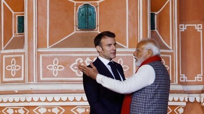 Prime Minister Narendra Modi and France's President Emmanuel Macron talk during their visit to the Hawa Mahal. (AFP) Prime Minister Narendra Modi and France's President Emmanuel Macron talk during their visit to the Hawa Mahal. (AFP)