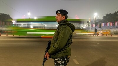 A security official stands guard at the Kartavya Path ahead of Republic Day, in New Delhi. (PTI)