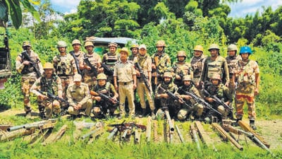Security forces in Manipur with arms recovered during raids. (HT PHOTO) Security forces in Manipur with arms recovered during raids. (HT PHOTO)