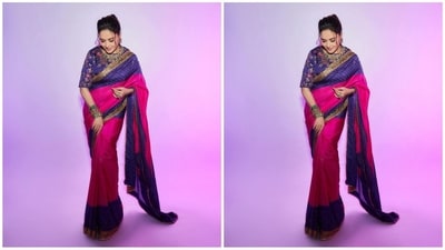 Madhuri's purple and pink silk saree features a traditional Rajasthani bandhani pattern that showcases a captivating tie-dye pattern. A graphic hand-embroidered gilded dancing peacock motif and a golden gotta border add a royal touch. She draped the saree elegantly and pair it up with a an intricate hand-embroidered purple blouse. (Instagram/@madhuridixitnene) Madhuri's purple and pink silk saree features a traditional Rajasthani bandhani pattern that showcases a captivating tie-dye pattern. A graphic hand-embroidered gilded dancing peacock motif and a golden gotta border add a royal touch. She draped the saree elegantly and pair it up with a an intricate hand-embroidered purple blouse. (Instagram/@madhuridixitnene)