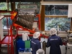 Employees monitor containers of snus moving along the production line at a factory of Swedish Match AB, owned by Philip Morris International Inc., in Gothenburg, Sweden, on Thursday, Sept. 21, 2023. Debate is raging over whether snus, nicotine-filled pouches resembling tiny teabags that users stuff under their upper lip, is the symptom or cause of Sweden�s breakup with smoking. Photographer: Nora Lorek/Bloomberg