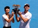 Poland's Jan Zielinski and Taiwan's Hsieh Su-wei pose with the trophy after winning their mixed doubles final match against Britain's Neal Skupski and Desirae Krawczyk of the U.S. 