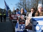 Pro-Israel activists gather near the International Court of Justice, or World Court, in The Hague, Netherlands, Friday.