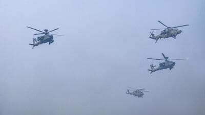 Advanced light helicopters fly past during the 75th Republic Day parade at the Kartavya Path in New Delhi on Friday. (PTI) Advanced light helicopters fly past during the 75th Republic Day parade at the Kartavya Path in New Delhi on Friday. (PTI)
