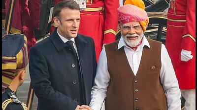French President Emmanuel Macron being received by Prime Minister Narendra Modi upon his arrival to attend the 75th Republic Day ceremony, in New Delhi (PTI) French President Emmanuel Macron being received by Prime Minister Narendra Modi upon his arrival to attend the 75th Republic Day ceremony, in New Delhi (PTI)