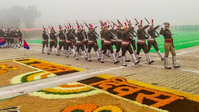 Security personnel march past during parade on the 75th Republic Day, in Faridabad. (PTI) Security personnel march past during parade on the 75th Republic Day, in Faridabad. (PTI)