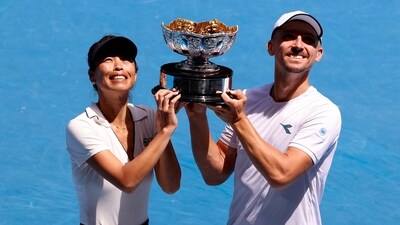 Poland's Jan Zielinski and Taiwan's Hsieh Su-wei pose with the trophy after winning their mixed doubles final match against Britain's Neal Skupski and Desirae Krawczyk of the U.S. (REUTERS)