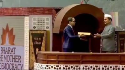 The tableau presented by the culture ministry showcased a replica of B R Ambedkar handing over the Constitution to the country’s first president Dr Rajendra Prasad (Twitter Photo) The tableau presented by the culture ministry showcased a replica of B R Ambedkar handing over the Constitution to the country’s first president Dr Rajendra Prasad (Twitter Photo)