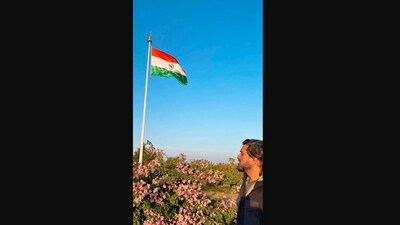The image shows MS Dhoni looking at the Indian flag. (Instagram/@sakshisingh_r) The image shows MS Dhoni looking at the Indian flag. (Instagram/@sakshisingh_r)