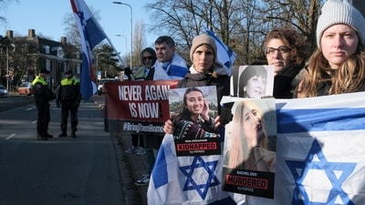 Pro-Israel activists gather near the International Court of Justice, or World Court, in The Hague, Netherlands, Friday. (AP) Pro-Israel activists gather near the International Court of Justice, or World Court, in The Hague, Netherlands, Friday. (AP)