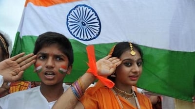 School children salute as they stand to attention and sing the national anthem Jana Gana Mana at a school in Hyderabad. (AFP file photo)