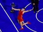 Belarus' Aryna Sabalenka poses with the trophy after winning the final against China's Qinwen Zheng