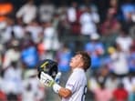England's Ollie Pope celebrates after scoring a century (100 runs) during the third day of the first Test cricket match between India and England at the Rajiv Gandhi International Stadium in Hyderabad on January 27 England's Ollie Pope celebrates after scoring a century (100 runs) during the third day of the first Test cricket match between India and England at the Rajiv Gandhi International Stadium in Hyderabad on January 27