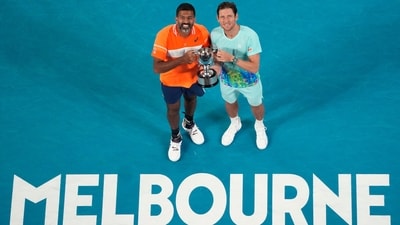Rohan Bopanna, left, of India and Matthew Ebden of Australia pose with their trophy after defeating Simone Bolelli and Andrea Vavassori of Italy in the men's doubles final. (AP)